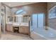 Luxurious bathroom with a soaking tub, vanity area, and custom lighting at 16333 E Crystal Point Dr, Fountain Hills, AZ 85268