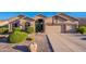 Inviting single-story home with a three-car garage and desert landscaping at 16333 E Crystal Point Dr, Fountain Hills, AZ 85268