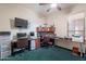 Functional home office with multiple desks, computer setups, and organized shelving units at 16333 E Crystal Point Dr, Fountain Hills, AZ 85268