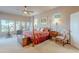 Spacious main bedroom with a four-poster bed, lots of windows, and workout equipment at 16333 E Crystal Point Dr, Fountain Hills, AZ 85268