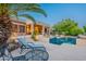 Relaxing patio area with lounge chairs and a view of the pool and desert landscape at 16333 E Crystal Point Dr, Fountain Hills, AZ 85268