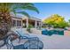 Relaxing pool area surrounded by lush greenery and a spacious patio with comfortable seating at 16333 E Crystal Point Dr, Fountain Hills, AZ 85268
