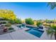 Lush backyard oasis featuring a sparkling pool, spa, and beautifully landscaped surroundings at 16333 E Crystal Point Dr, Fountain Hills, AZ 85268