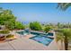 Inviting pool and spa area with lush landscaping and waterfall features at 16333 E Crystal Point Dr, Fountain Hills, AZ 85268