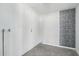 Clean basement space with white painted walls and decorative wall art on one wall at 1653 E Palmcroft Dr, Tempe, AZ 85282