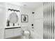 Modern bathroom with sleek fixtures, white cabinets and minimalist design at 1653 E Palmcroft Dr, Tempe, AZ 85282