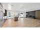 Spacious living room with brick fireplace, wood-style floors, and natural light at 1653 E Palmcroft Dr, Tempe, AZ 85282