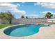 Backyard with a sparkling swimming pool, mature trees and plenty of space to relax at 1653 E Palmcroft Dr, Tempe, AZ 85282