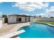 Backyard pool with diving board, patio, and well-maintained landscaping at 1653 E Palmcroft Dr, Tempe, AZ 85282