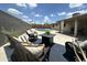 Landscaped backyard with a swimming pool, lounge furniture, a dark blue outdoor rug and a gas fire pit at 1661 E Bishop Dr, Tempe, AZ 85282