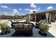 Inviting backyard featuring a refreshing pool, comfortable seating, and a covered patio area for relaxation and entertainment at 1661 E Bishop Dr, Tempe, AZ 85282