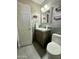 Compact bathroom featuring a modern vanity, toilet, and clean, tiled flooring for a functional space at 1661 E Bishop Dr, Tempe, AZ 85282