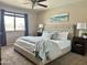 Cozy bedroom features a large bed, soft lighting, and calming decor for a peaceful retreat at 1661 E Bishop Dr, Tempe, AZ 85282