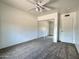Simple bedroom design with mirrored closet doors and neutral carpet, providing a versatile space at 1661 E Bishop Dr, Tempe, AZ 85282