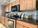 This kitchen features stainless steel appliances, granite countertops, and ample cabinet space at 1661 E Bishop Dr, Tempe, AZ 85282