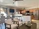 Inviting living room with breakfast bar, TV, comfortable chairs, and stainless steel appliances in the adjacent kitchen at 1661 E Bishop Dr, Tempe, AZ 85282