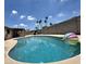 Backyard pool with lounge furniture and a beach ball for some fun in the sun at 1661 E Bishop Dr, Tempe, AZ 85282