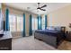 Tranquil bedroom with plush carpeting, lots of natural light, and dark furnishings at 1680 S Arroyo Ln, Gilbert, AZ 85295