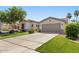 Lovely home featuring a two-car garage, desert landscaping, and a welcoming entrance at 1680 S Arroyo Ln, Gilbert, AZ 85295
