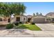 Charming single-story home with well-manicured lawn, mature trees, and inviting curb appeal at 1680 S Arroyo Ln, Gilbert, AZ 85295