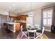 Beautiful kitchen with a center island, a breakfast nook, stainless steel appliances, and plenty of cabinet space at 1680 S Arroyo Ln, Gilbert, AZ 85295