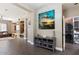 Bright living space with eye-catching art, open to the laundry and additional living areas at 1680 S Arroyo Ln, Gilbert, AZ 85295