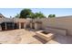 Inviting outdoor kitchen featuring a built-in grill, stone countertops, fire pit, and convenient seating at 1680 S Arroyo Ln, Gilbert, AZ 85295