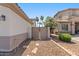 View of a side yard with stone pathway, mature shrubs, and privacy fencing at 1680 S Arroyo Ln, Gilbert, AZ 85295