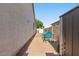Functional side yard with paved area, perfect for outdoor dining and enjoying the sunshine at 1680 S Arroyo Ln, Gilbert, AZ 85295