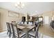 Charming dining room adjacent to kitchen offers the perfect place to host gatherings at 17820 W Charter Oak Rd, Surprise, AZ 85388