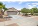 Beautiful home featuring desert landscaping, a two-car garage, and a well-maintained front yard at 17820 W Charter Oak Rd, Surprise, AZ 85388