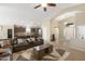 Open-concept living space featuring a comfortable seating area and seamless flow to the kitchen at 17820 W Charter Oak Rd, Surprise, AZ 85388