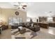 Spacious living room featuring vaulted ceilings, large windows, and an open-concept design at 17820 W Charter Oak Rd, Surprise, AZ 85388