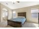 Serene main bedroom with neutral colors, plush carpeting, and a tranquil ambiance at 17820 W Charter Oak Rd, Surprise, AZ 85388