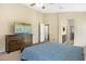 Spacious main bedroom showcasing an ensuite bathroom, walk-in closet, and large dresser at 17820 W Charter Oak Rd, Surprise, AZ 85388
