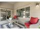 Cozy covered patio with stylish furniture, ideal for relaxing outdoors and enjoying the fresh air at 17820 W Charter Oak Rd, Surprise, AZ 85388