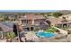 Aerial view of the home showcasing the pool, patio, and landscaped backyard at 18121 W Las Cruces Dr, Goodyear, AZ 85338