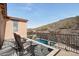 Balcony featuring seating with views of the pool and desert landscape at 18121 W Las Cruces Dr, Goodyear, AZ 85338