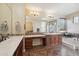 Elegant bathroom featuring double sinks, a makeup vanity, a tub, and decorative tile flooring at 18121 W Las Cruces Dr, Goodyear, AZ 85338