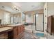 Bright bathroom features a soaking tub, glass shower, double vanity and attractive decorative tile accents at 18121 W Las Cruces Dr, Goodyear, AZ 85338