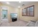 Cozy bedroom with plantation shutters and balcony access at 18121 W Las Cruces Dr, Goodyear, AZ 85338