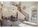 Beautiful dining room with staircase, chandelier, and natural light at 18121 W Las Cruces Dr, Goodyear, AZ 85338