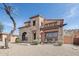 Stunning home boasts stone accents, beautiful landscaping, and a private patio at 18121 W Las Cruces Dr, Goodyear, AZ 85338