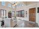 Bright living room with vaulted ceilings, large windows, and tile flooring at 18121 W Las Cruces Dr, Goodyear, AZ 85338