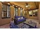 Inviting covered patio features comfortable seating, overhead lighting, and a ceiling fan for relaxation at 18121 W Las Cruces Dr, Goodyear, AZ 85338