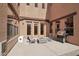 Cozy patio with seating, a fire pit, and a grill, ideal for outdoor gatherings at 18121 W Las Cruces Dr, Goodyear, AZ 85338