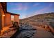 Balcony with seating and desert views, enhancing the outdoor living experience in this beautiful home at 18121 W Las Cruces Dr, Goodyear, AZ 85338