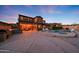 Luxurious backyard with pool, spa, outdoor kitchen, and inviting patio area for entertaining and relaxation at 18121 W Las Cruces Dr, Goodyear, AZ 85338