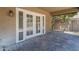 Inviting covered patio with brick pavers and elegant french doors at 1838 W Enfield Way, Chandler, AZ 85286