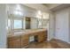 Bathroom featuring a large vanity with double sinks, tiled floors, and separate mirrors, with a walk-in shower at 1838 W Enfield Way, Chandler, AZ 85286